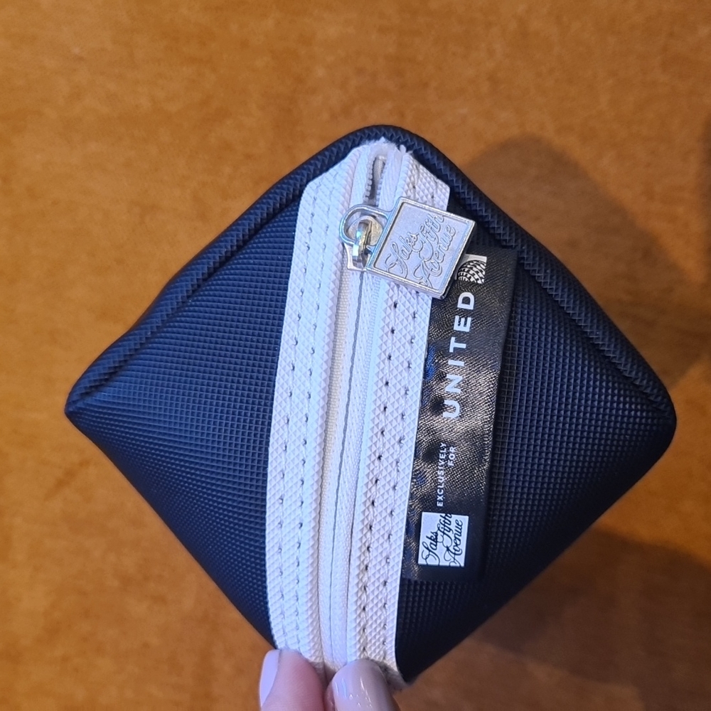 United Airline x Saks Fifth business class pouch